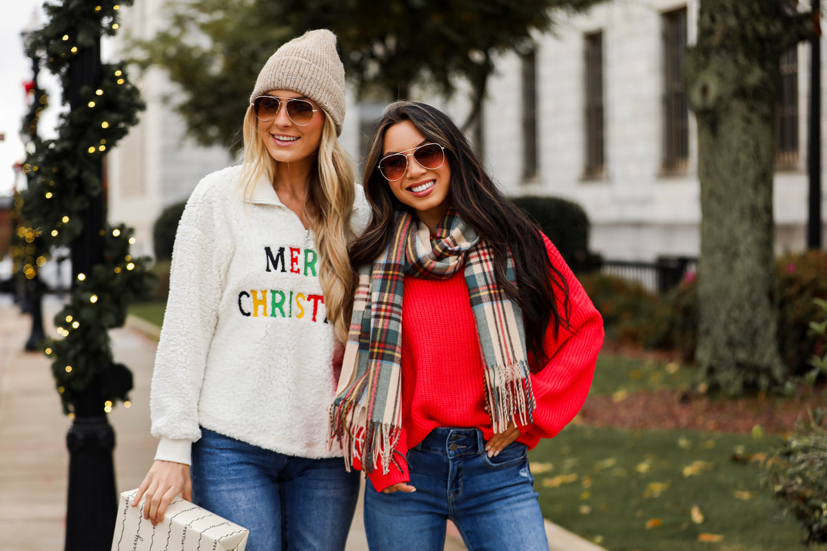 models wearing cozy christmas sweaters