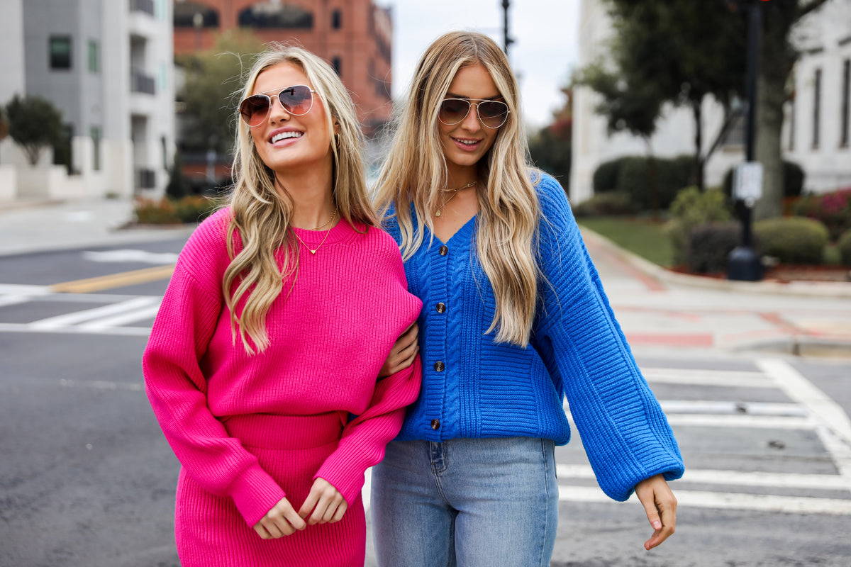 models wearing colorful oversized sweaters