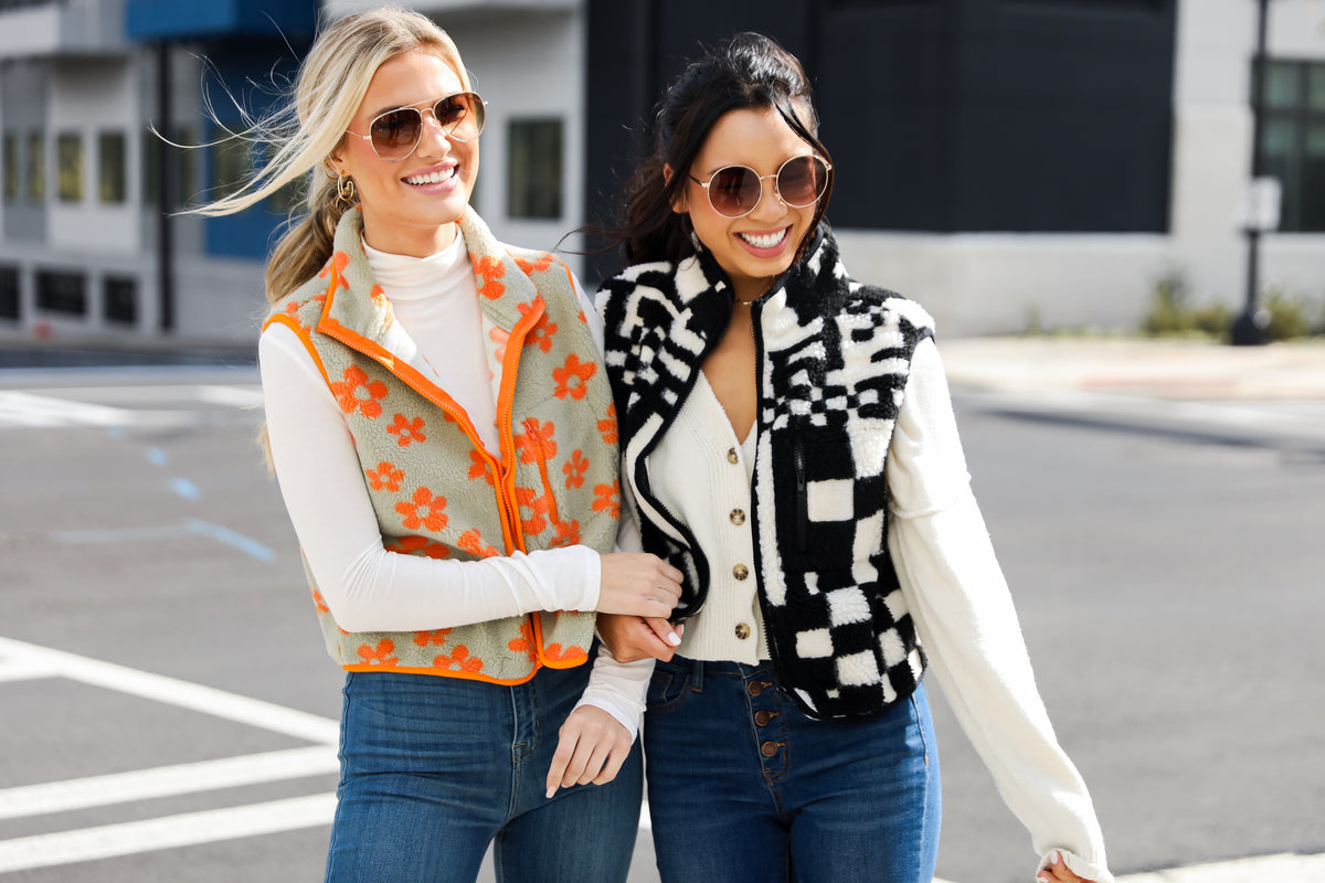 models wearing cozy sherpa vests