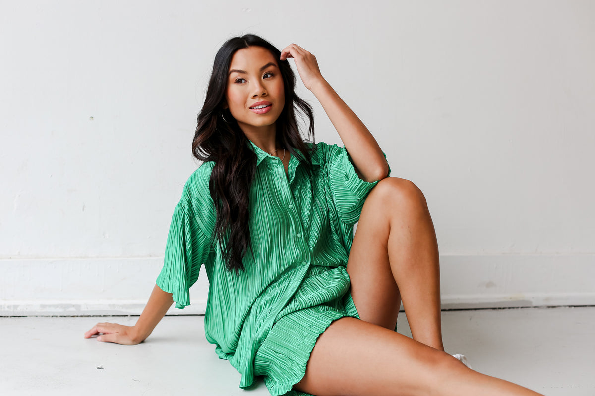 model wearing a cute green plisse matching set