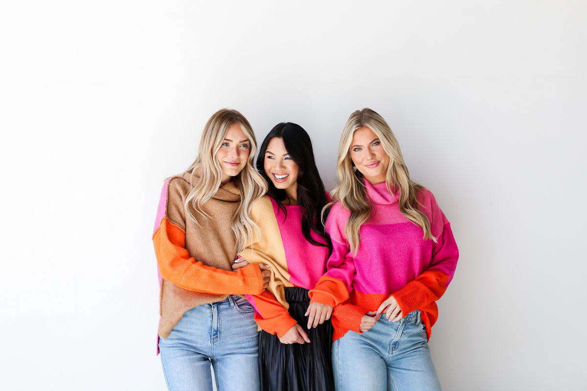models wearing hot pink sweaters