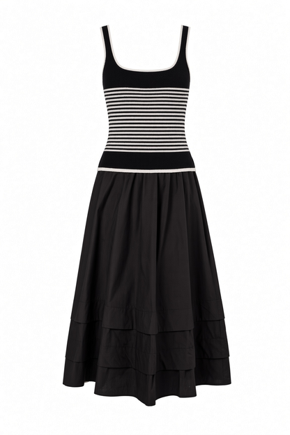 A black and white striped sleeveless tank dress with a tiered skirt, shown against a plain white background.