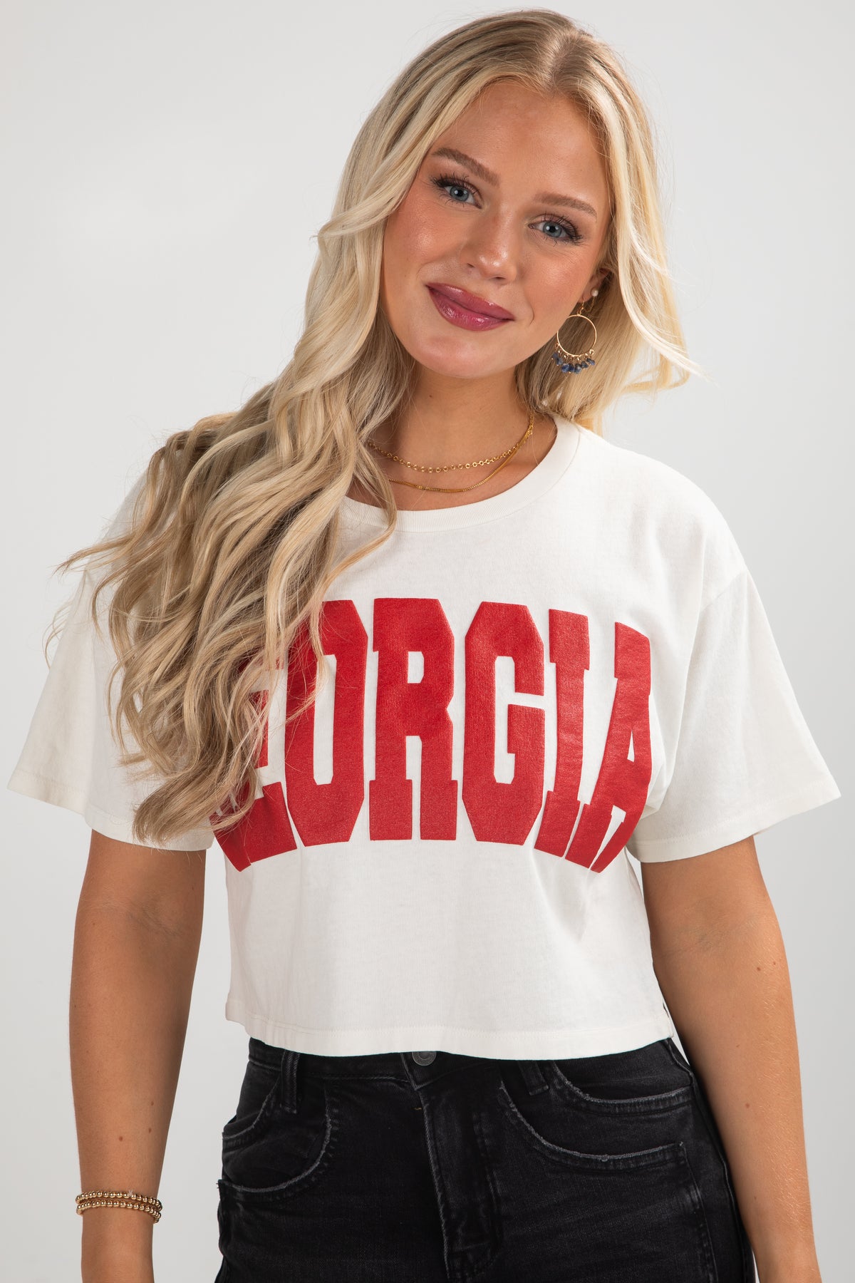 Woman wearing a white t-shirt with &