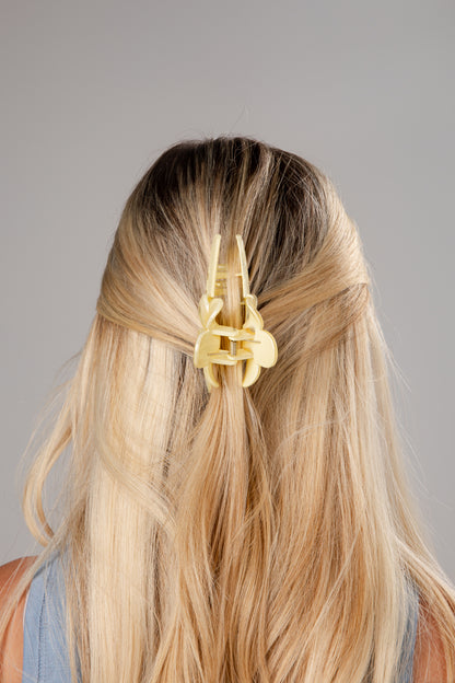 Gold hair clip in a person&