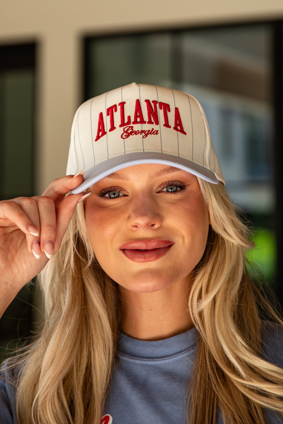 Woman wearing a cap with &