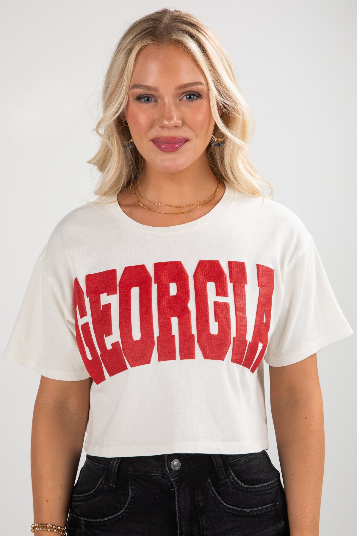Woman wearing a white t-shirt with &