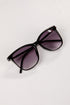 Black sunglasses with purple lenses on a white background