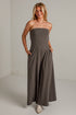 A dark gray strapless wide-leg jumpsuit with side pockets