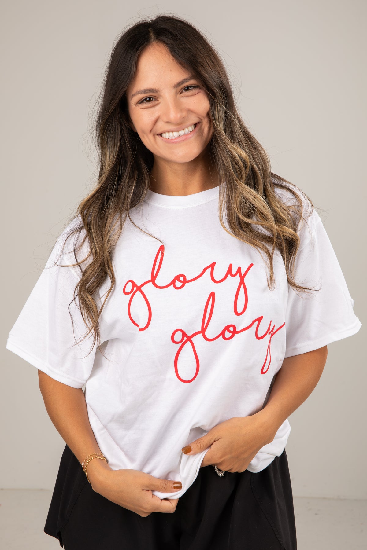 Woman wearing a white t-shirt with &