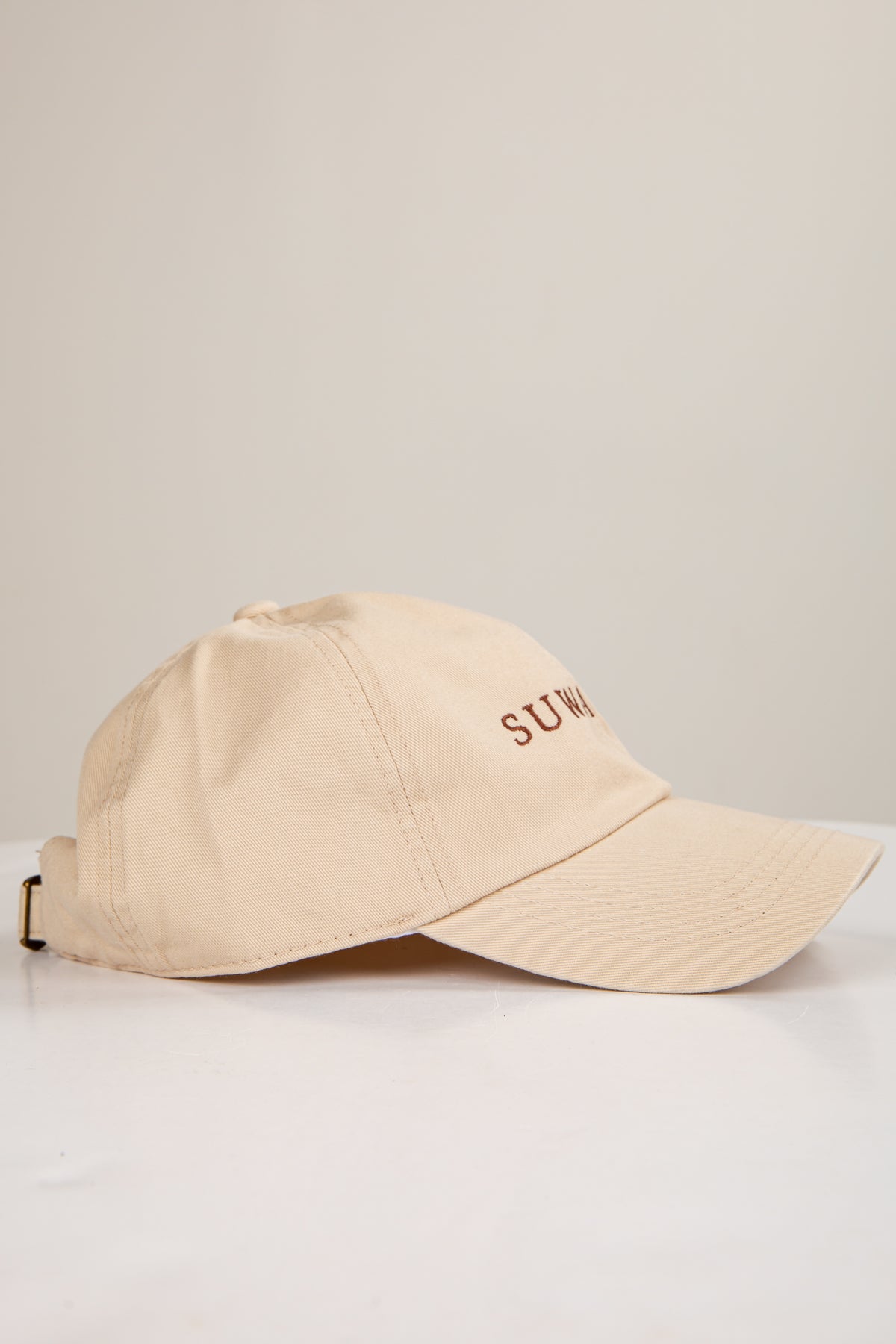 Beige cap with &