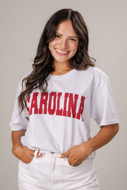 Woman wearing a white t-shirt with &