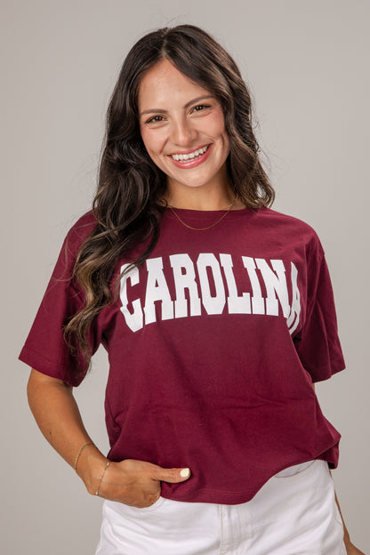 Woman wearing a maroon &