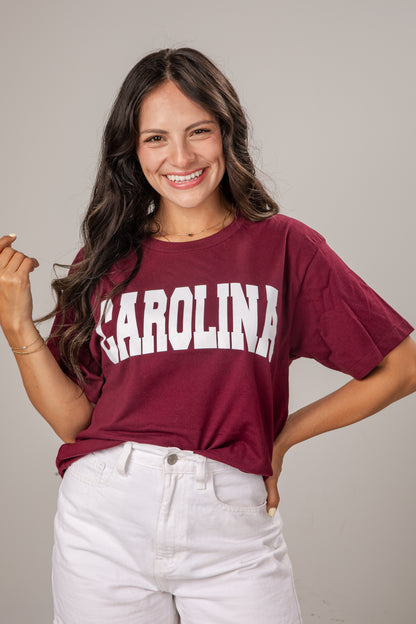 Woman wearing a maroon &