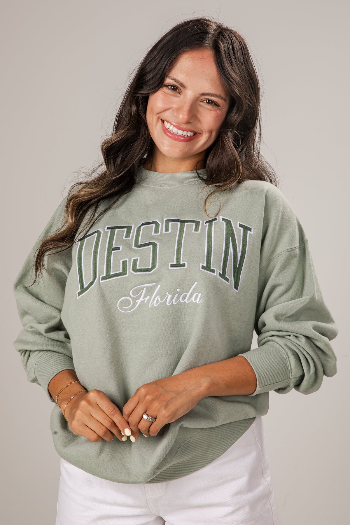 Woman wearing a green &