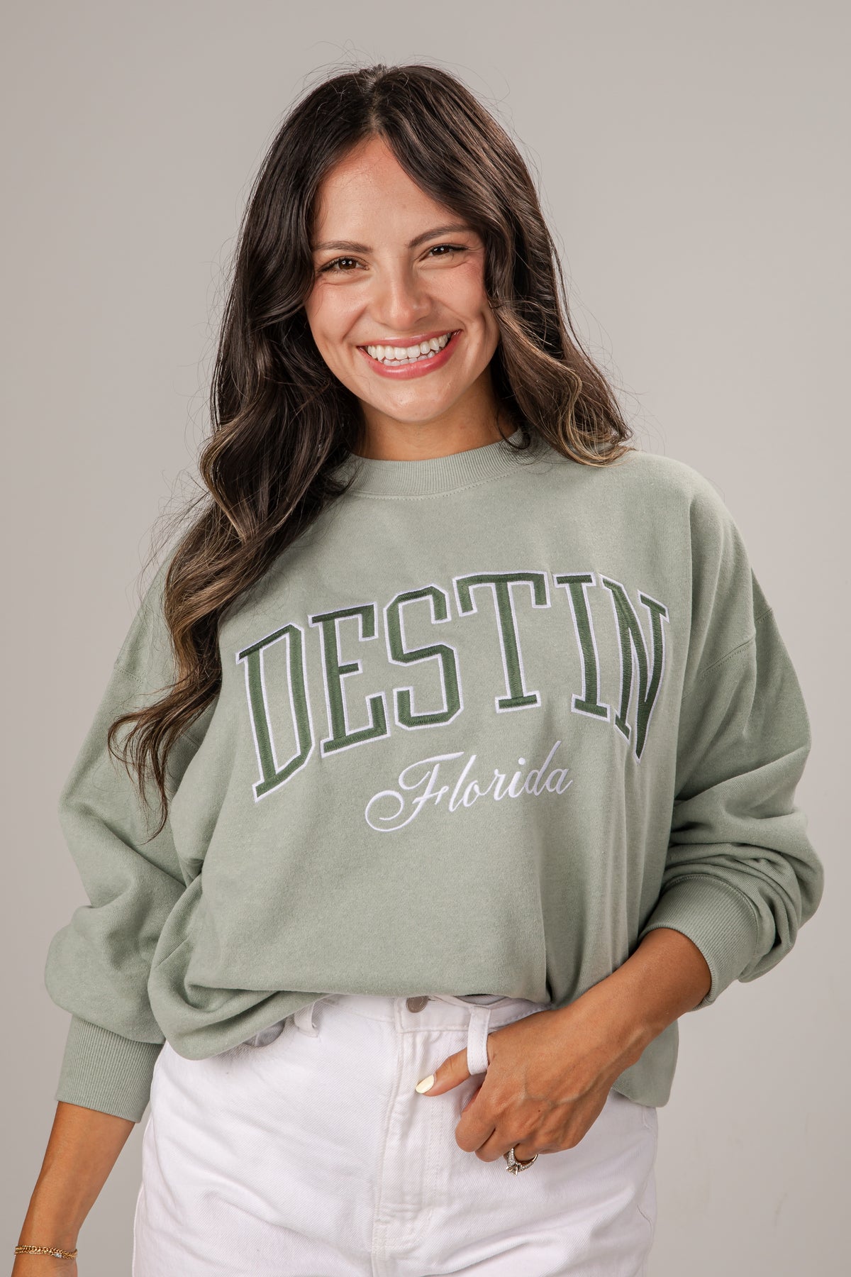 Woman wearing a green &