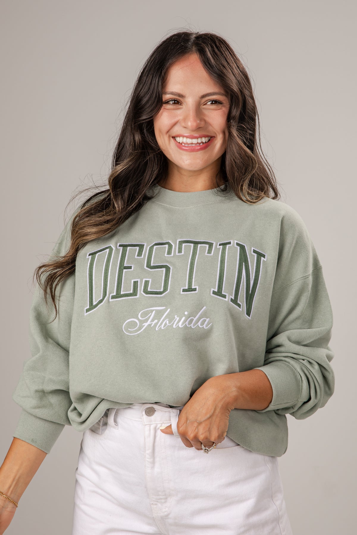 Woman wearing a green &