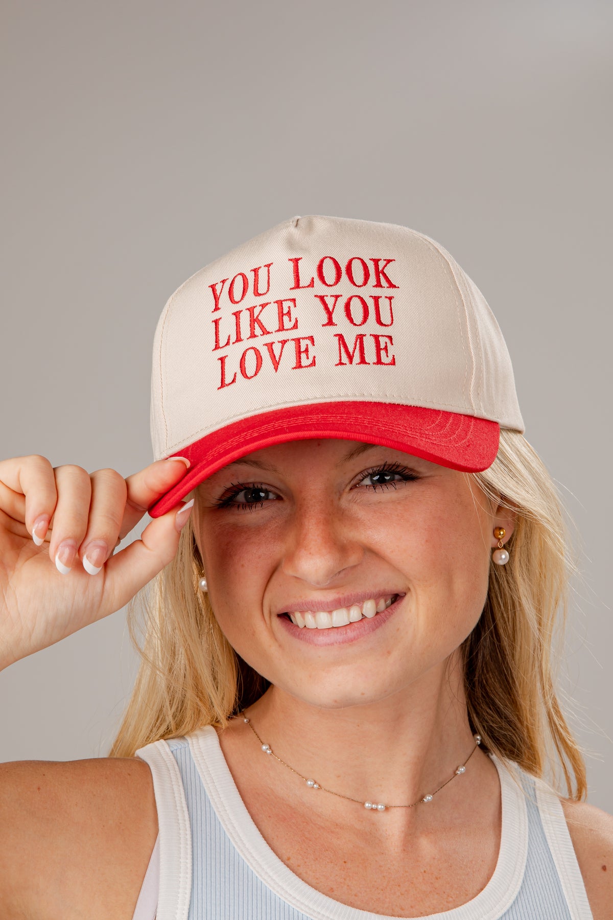 Woman wearing a cap with &