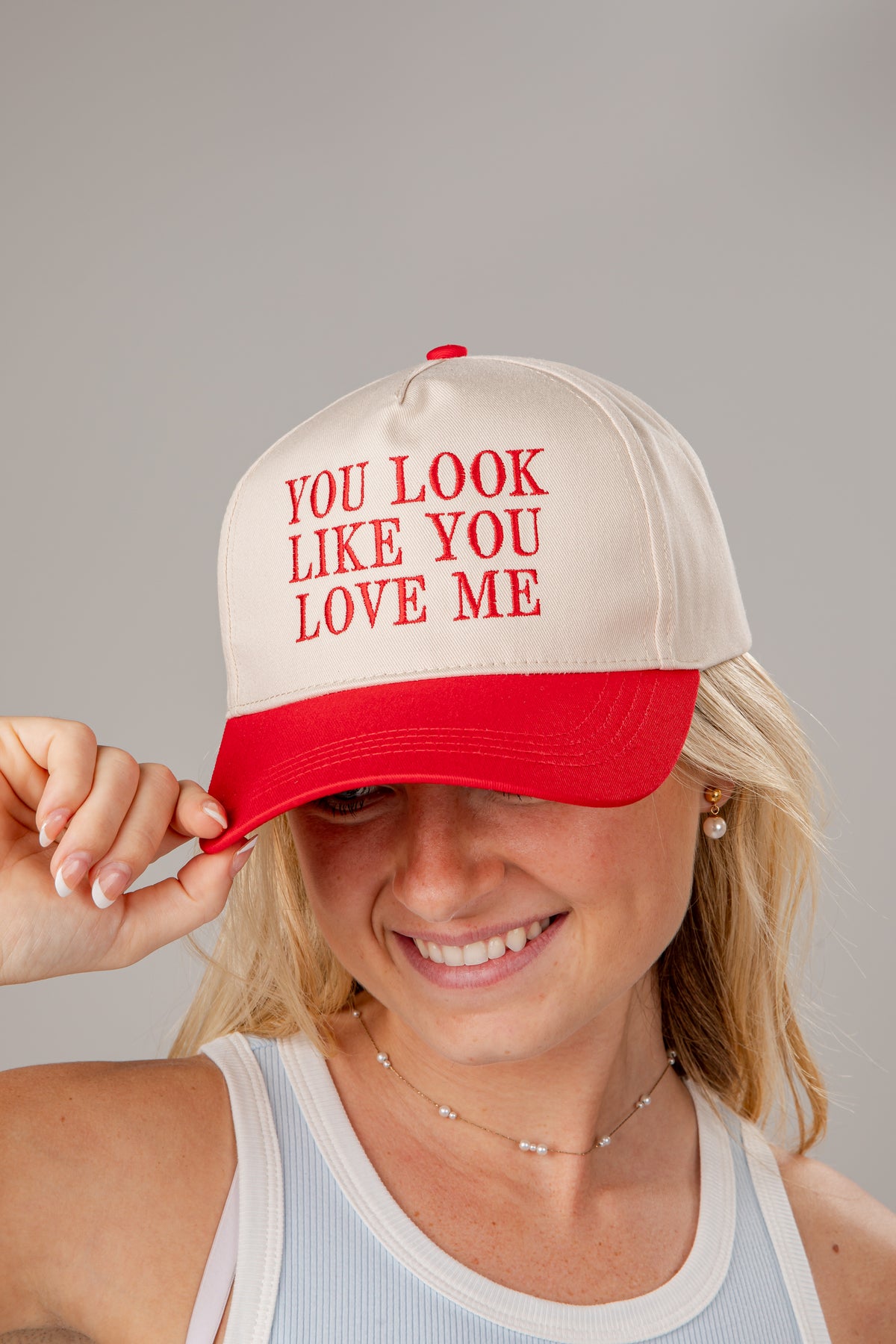Person wearing a cap with &