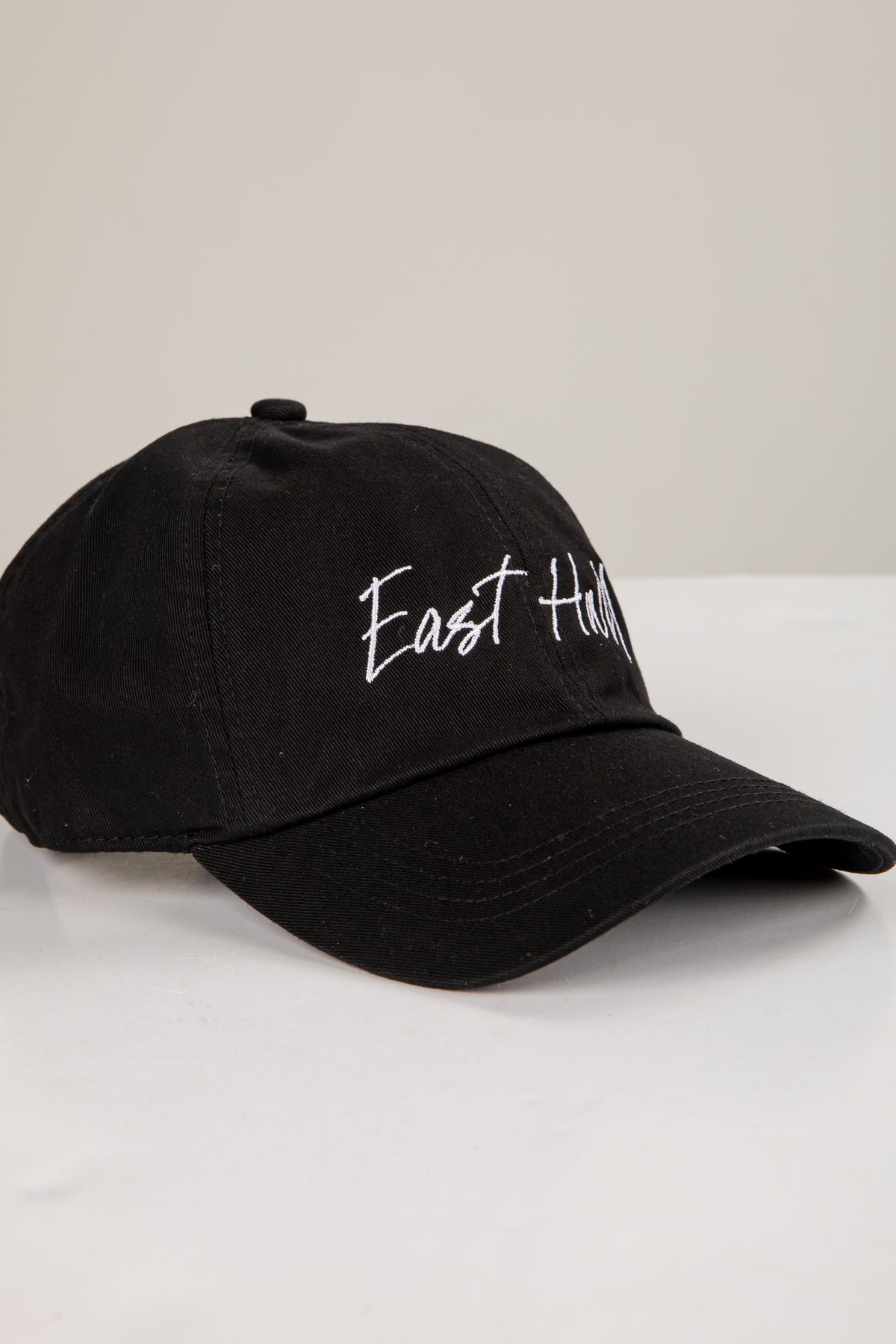 Black cap with &