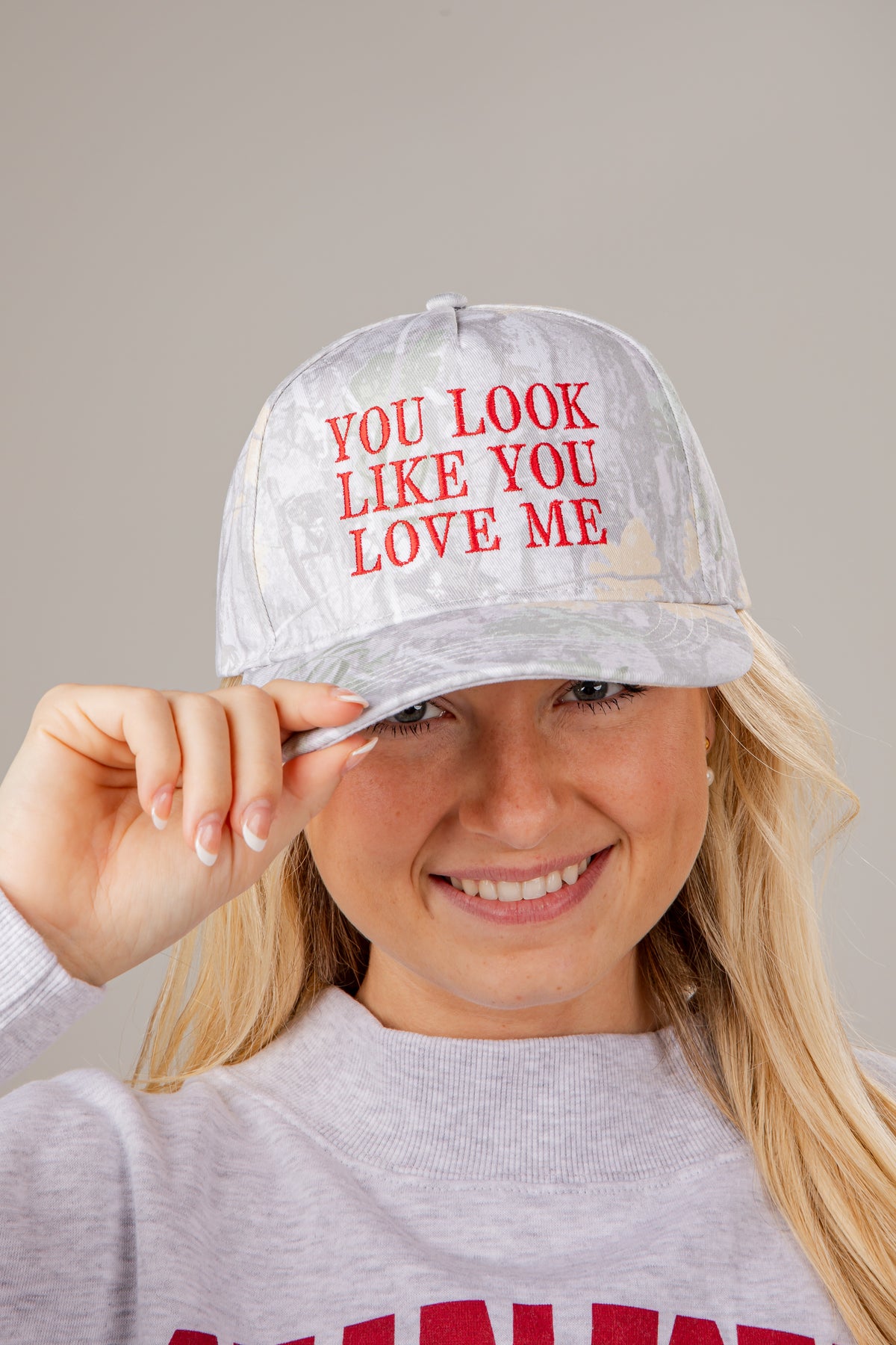 Person wearing a cap with &
