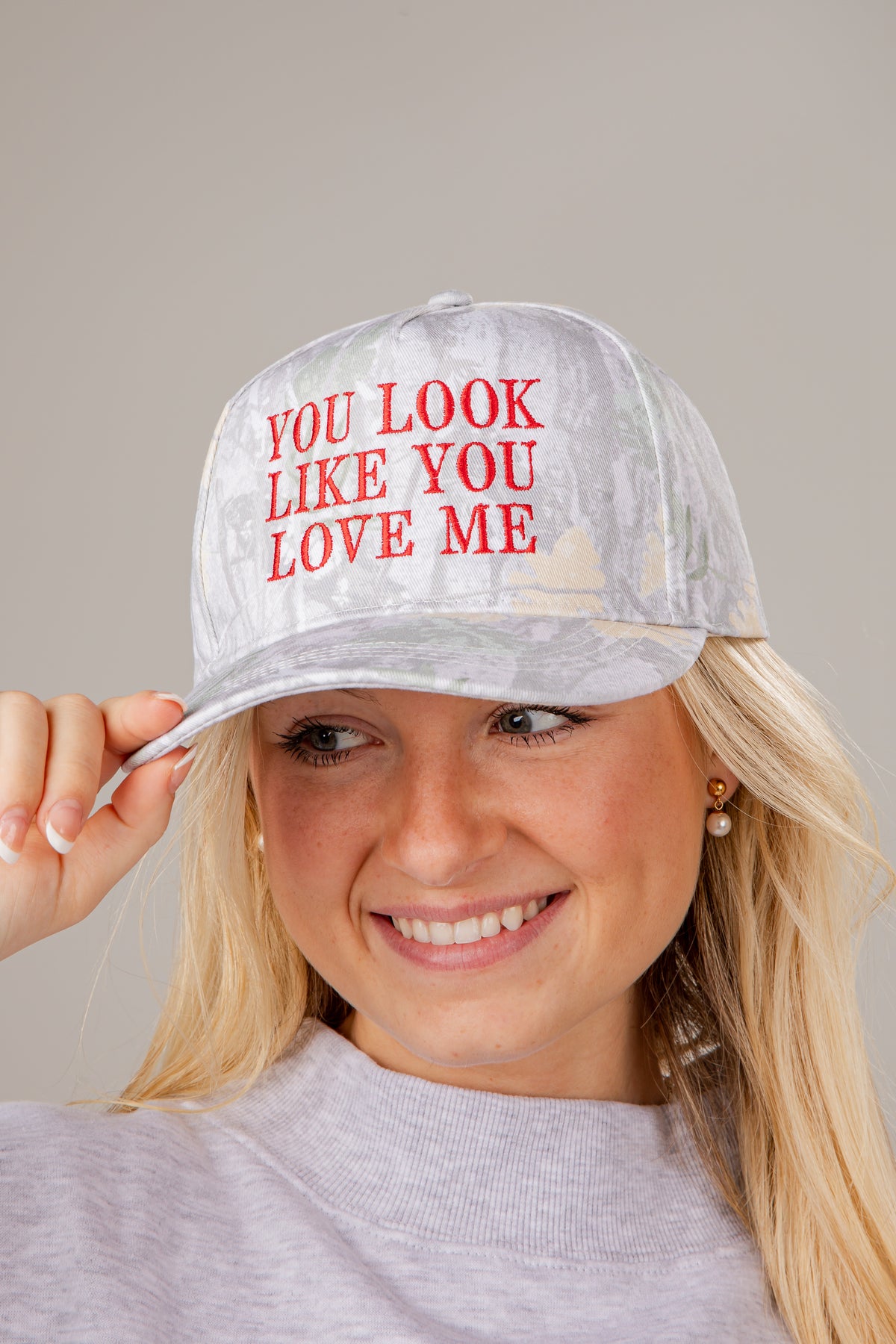 Person wearing a cap with &
