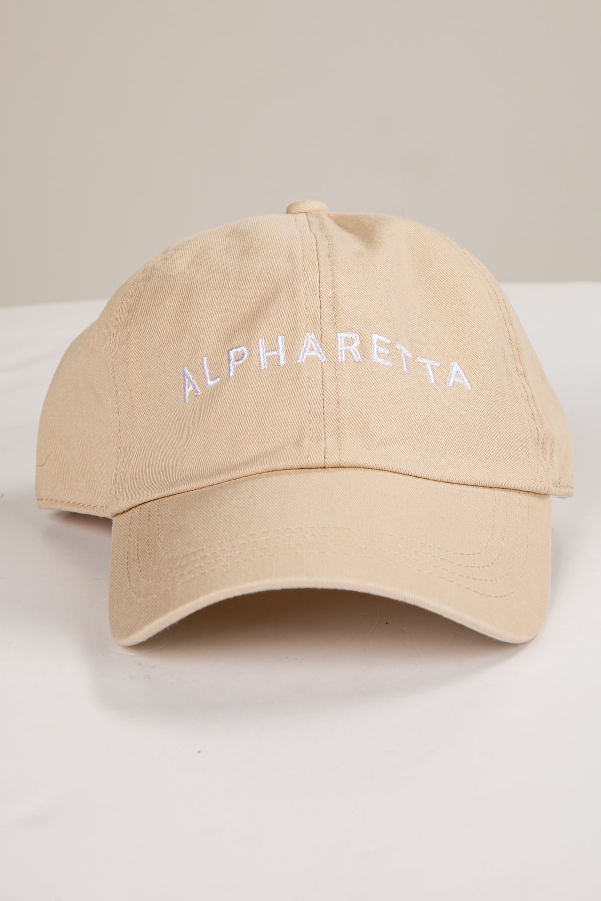 Beige cap with &