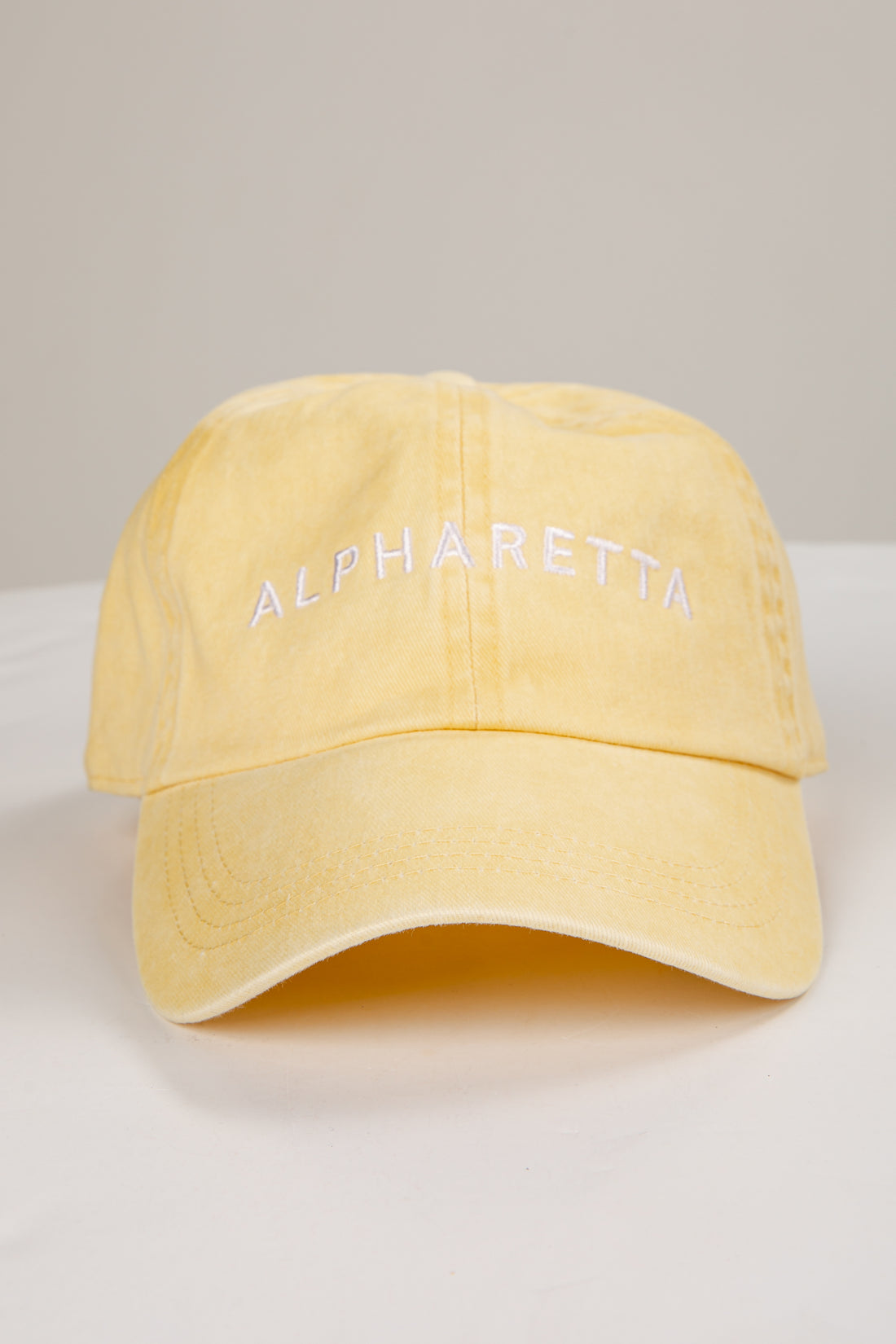 Yellow cap with &