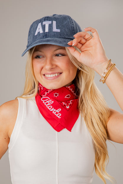 Woman wearing a denim cap with &