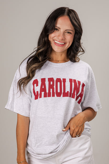 Woman wearing a white t-shirt with &