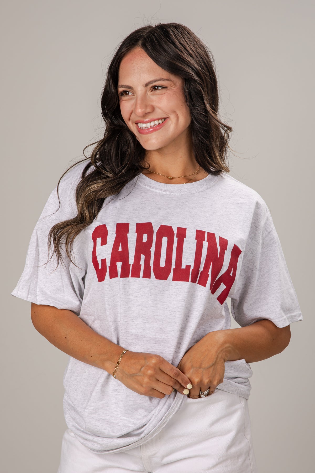 Woman wearing a gray t-shirt with &