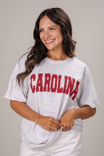 Woman wearing a gray t-shirt with &