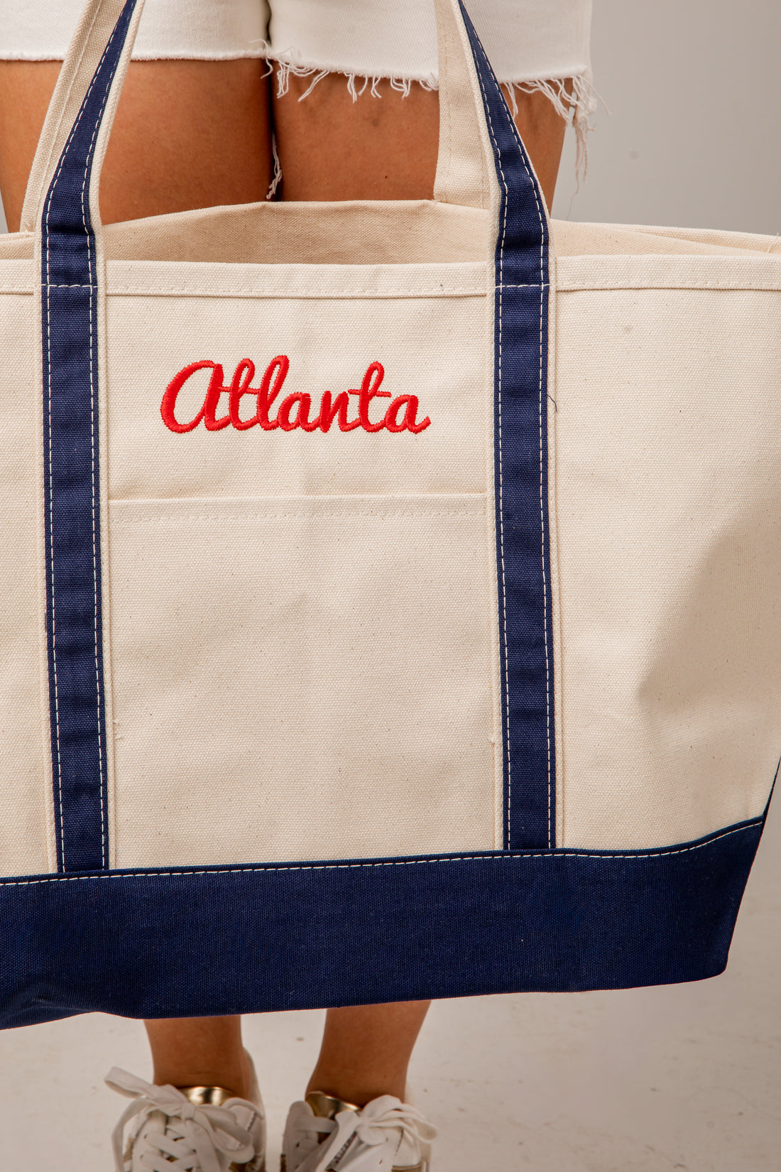 Beige tote bag with &