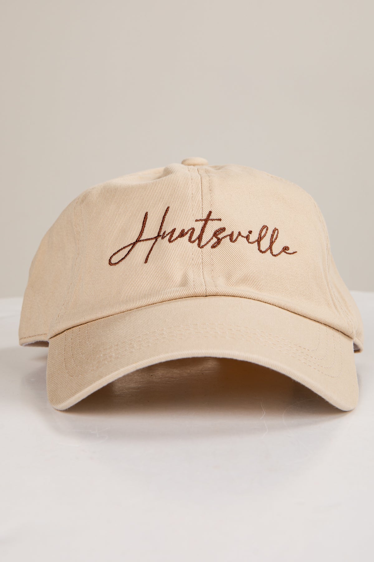 Beige cap with &