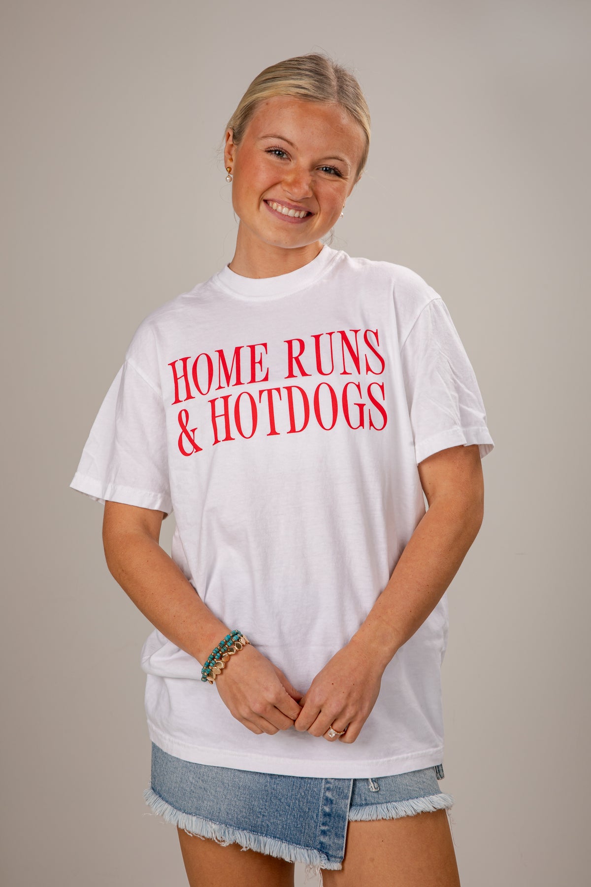 Person wearing a white t-shirt with &