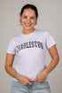 Woman wearing a white t-shirt with &