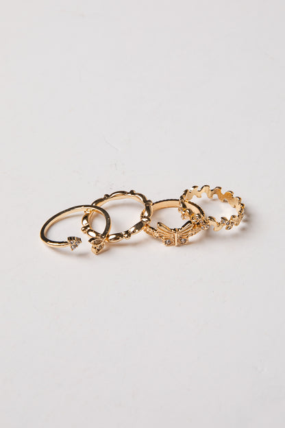 Set of gold hoop earrings on a light gray background