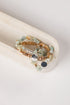 Set of beaded bracelets on a white surface