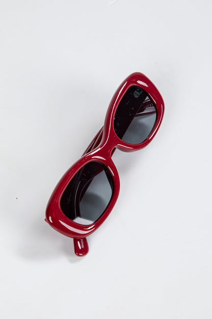 Red sunglasses on a white background