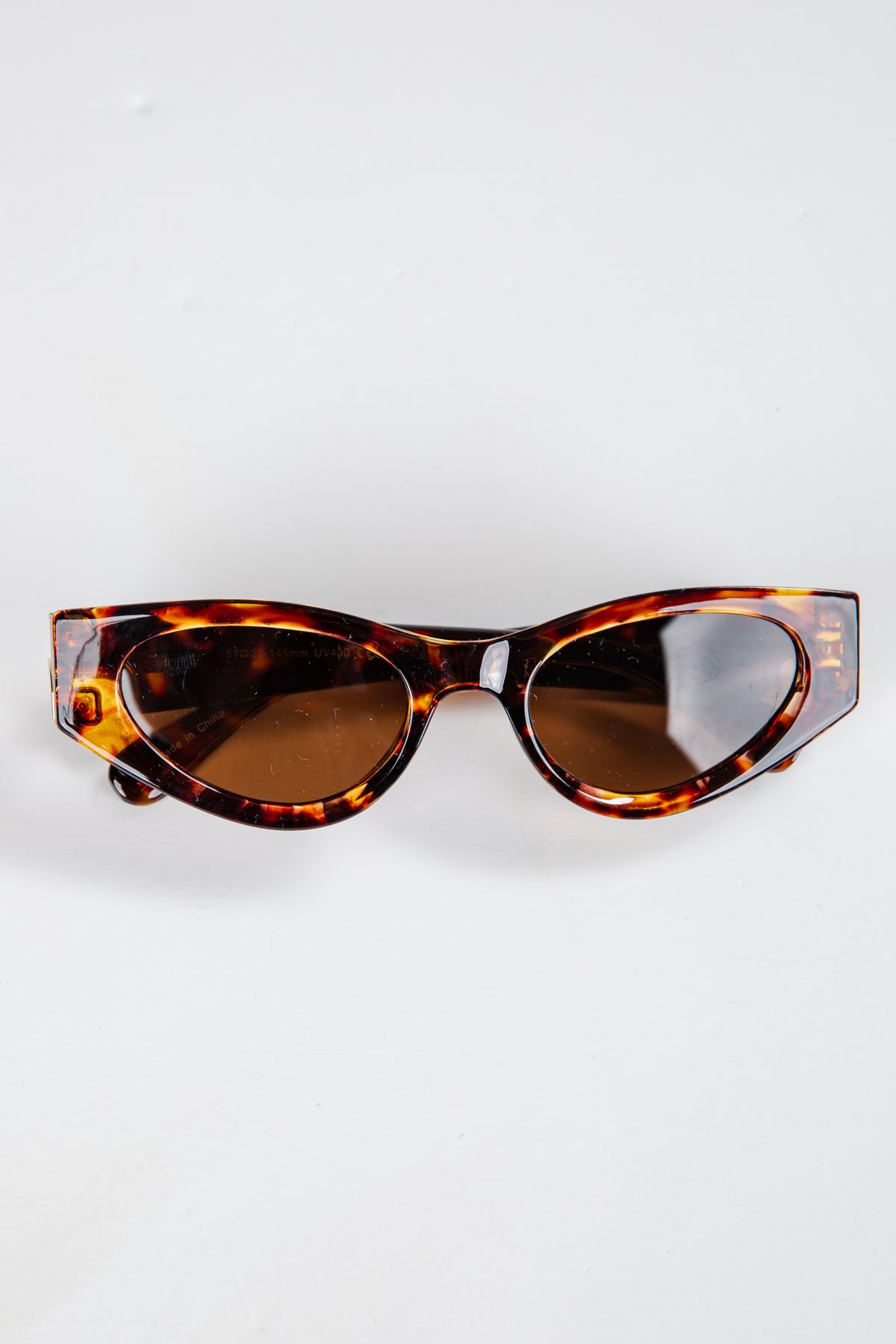 Tortoiseshell sunglasses on a white background