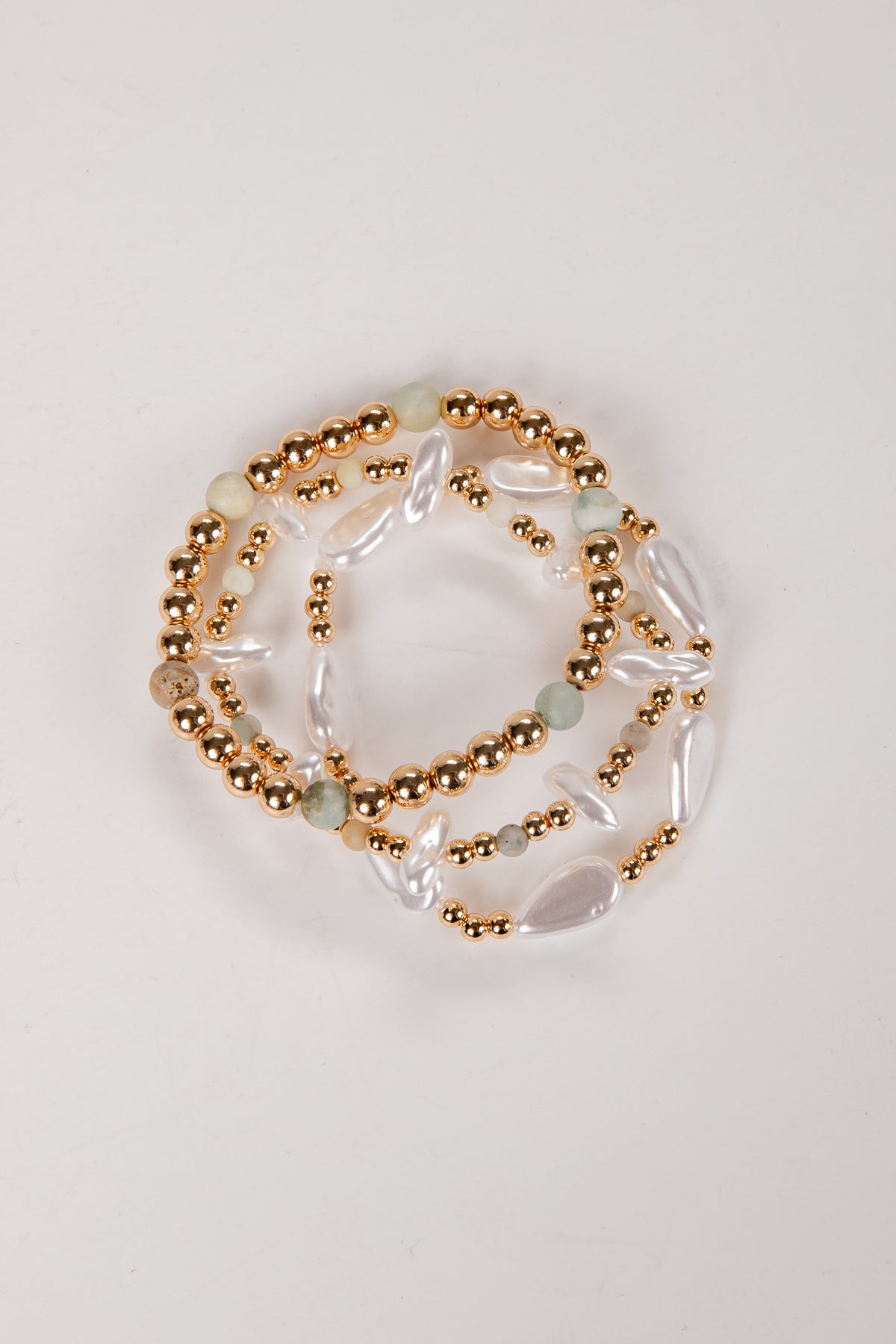 Set of beaded bracelets on a light background
